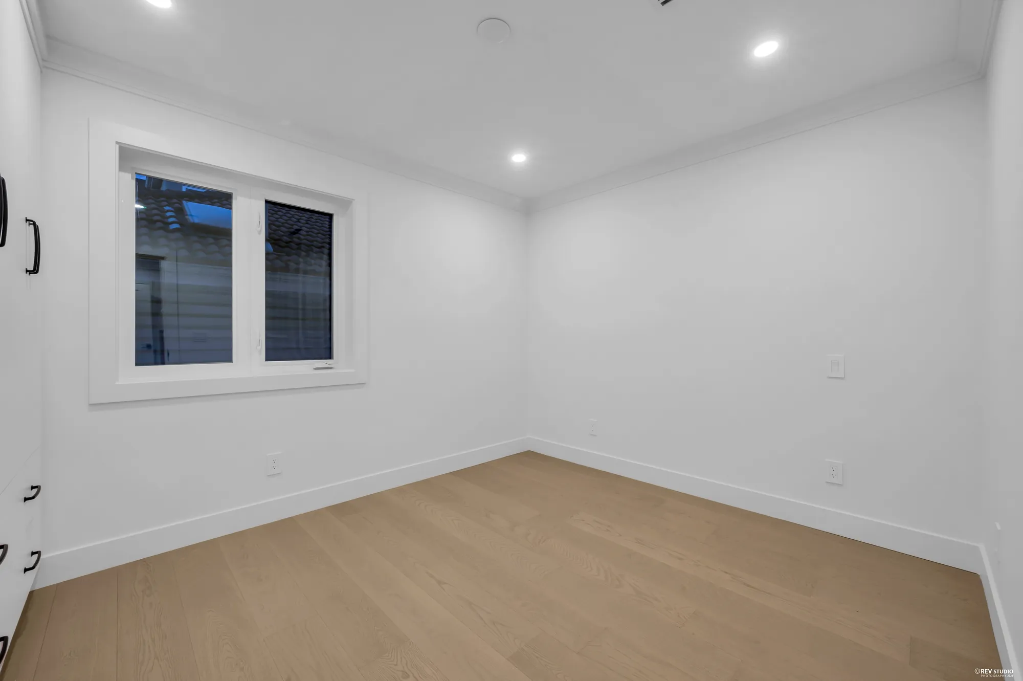 The second bedroom on this floor, with a window to the side
