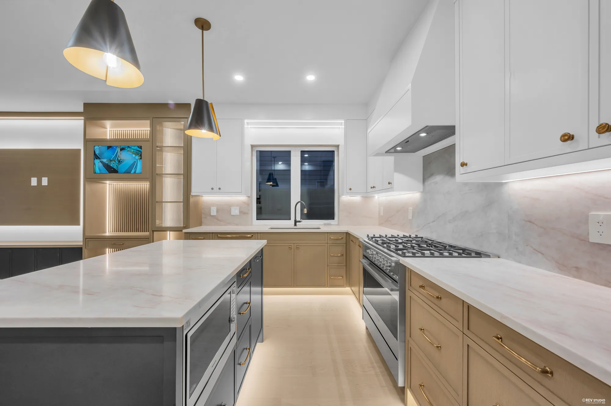 The range and hood set into full-height cabinetry