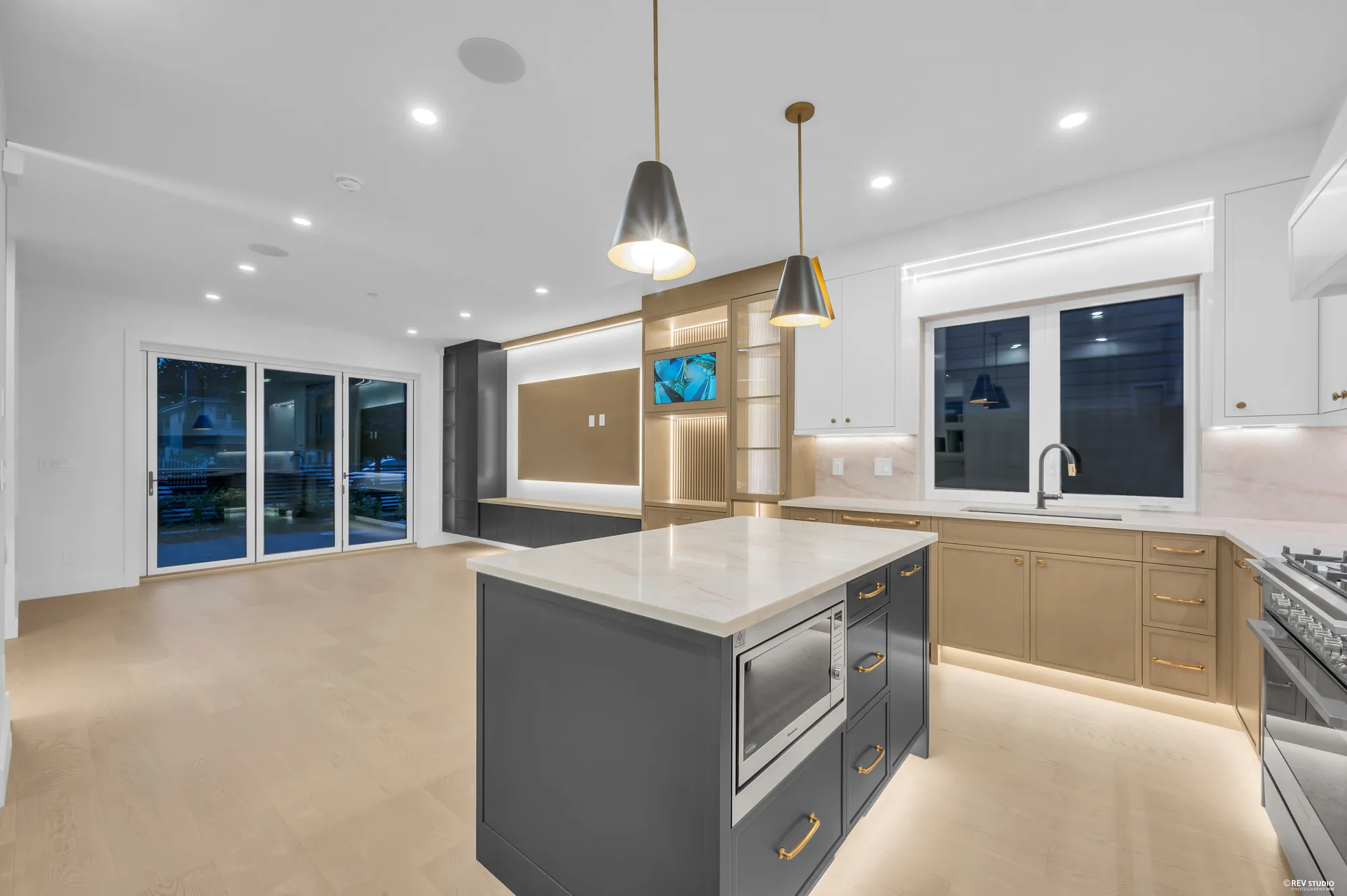 Kitchen counter and backsplash seen close, with the window beyond