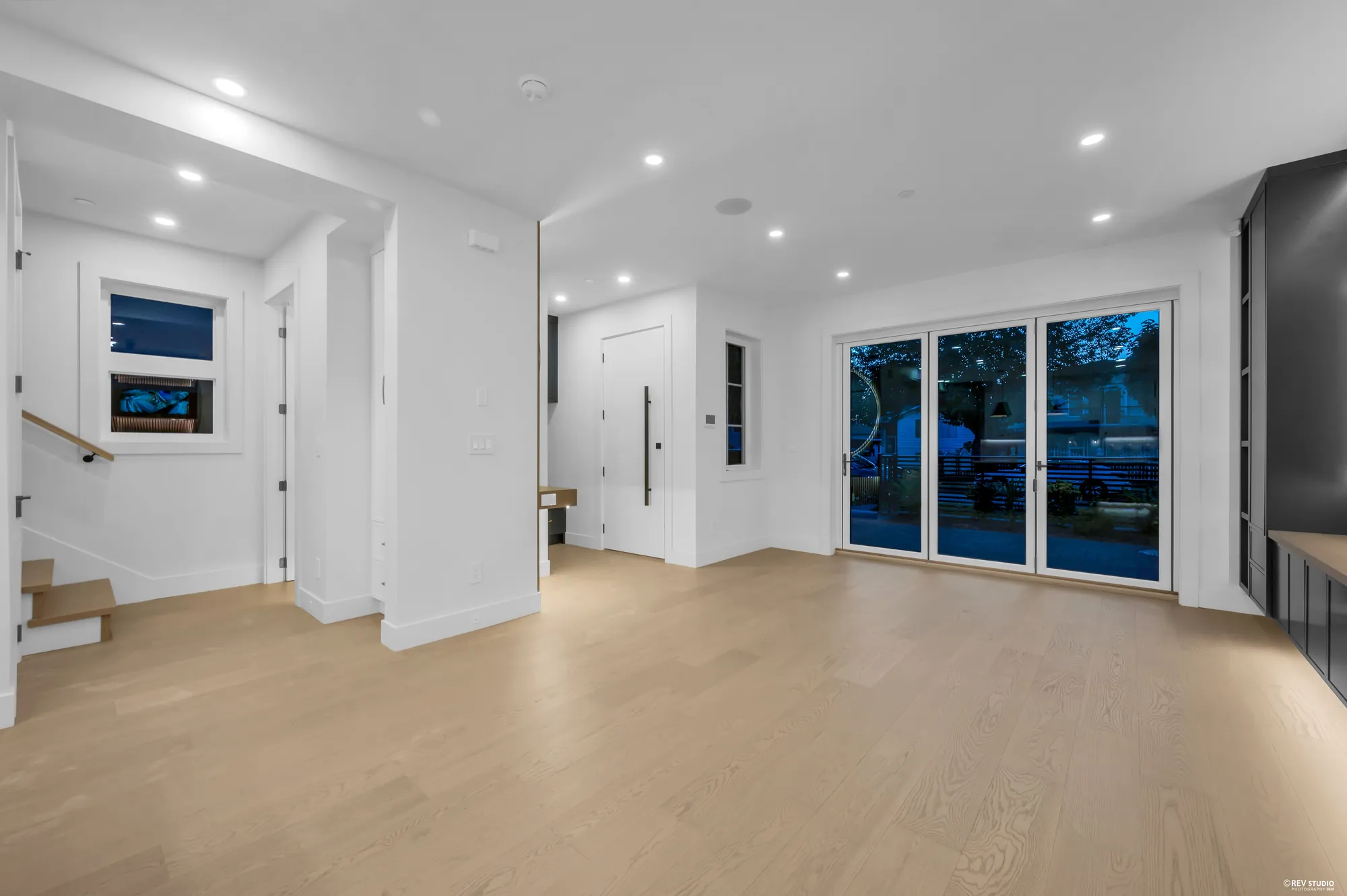 Living area with the stair rising on the right